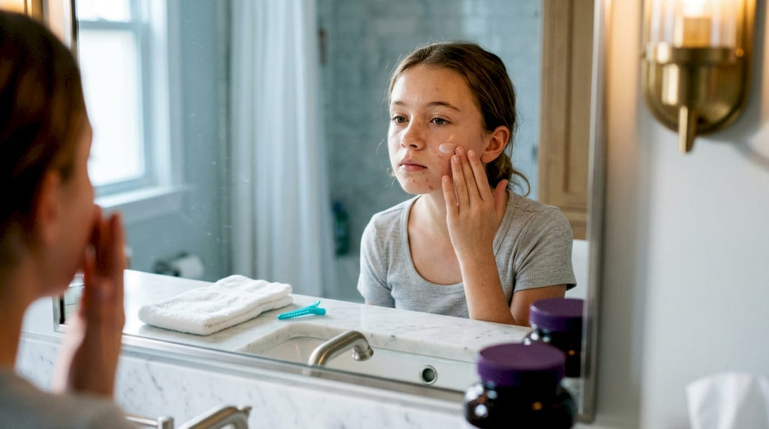 Tween applying moisturizer in bathroom mirror